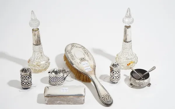 Silver and silver mounted wares, comprising; a pair of scent bottles, a pair of pepperettes, London 1915, an oval mustard pot, two salt spoons, a Vict