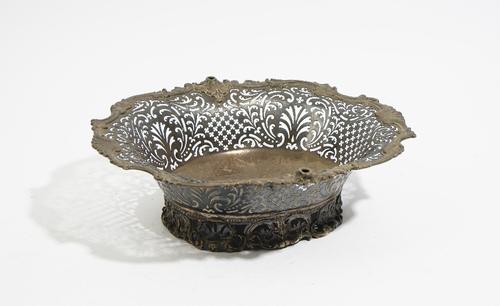 A George II shaped oval silver cake basket, by Samuel Herbert & Co, London 1750, pierced with quatrefoils and leaf scrolls beneath a cast shell and le
