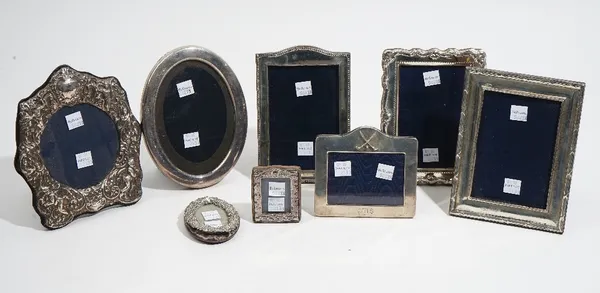 A silver mounted shaped rectangular photograph frame, Birmingham 1924 and seven further silver mounted photograph frames, mostly modern, (8).