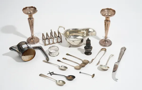 Silver and silver mounted wares, comprising; a sauceboat, a top mount from a claret jug, a toastrack, a pepperette, a napkin ring, a pair of bud vases