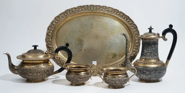 Asian tea wares, comprising; a shaped oval tray, having a decorated border, detailed Silver, length 43.5cm, weight 1115 gms, a plated three piece tea