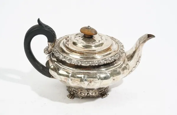 A George IV silver teapot, by Charles Price, London 1825, of fluted compressed circular form, with a hinged cover, a foliate rim, the oak leaf and aco