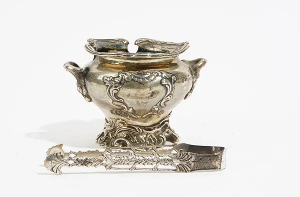 A William IV silver sugar basin, London 1833, maker's mark unclear, of ogee circular form, with foliate cast scrolled side handles and vacant cartouch