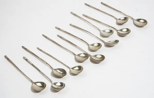 A collection of 12 Russian silver spoons, third quarter 19th century, some dated 1882, with twisted stems and foliate engraved pear shape bowls, 5ozs.