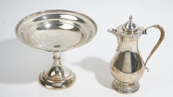 A George III style silver pear shape water jug, by Marston & Bayliss, Birmingham 1905, with gadroon rim and foot, hinged cover and wicker bound handle