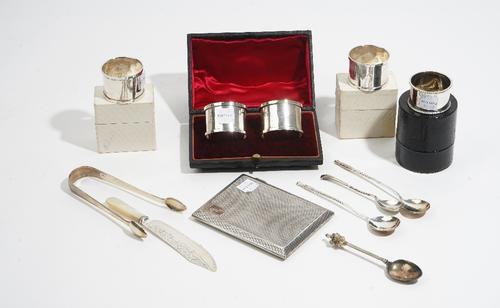 Silver and silver mounted wares, comprising: a rectangular cigarette case, a pair of napkin rings, Chester 1918, cased, a pair of napkin rings engrave