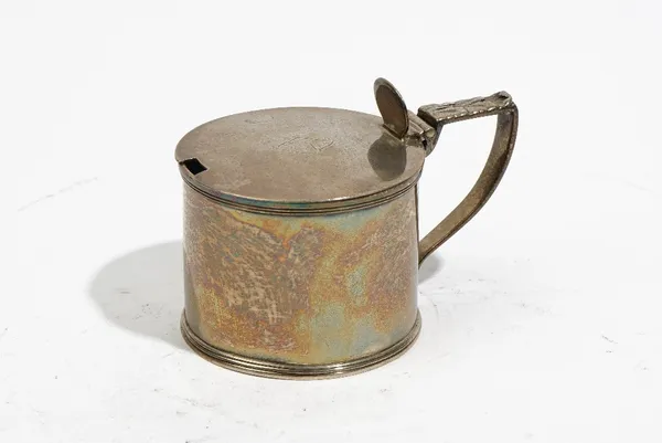 A George III silver mustard pot, of cylindrical form, with a foliate capped handle and plain thumbpiece, maker Robert Eames and Edward Barnard, London