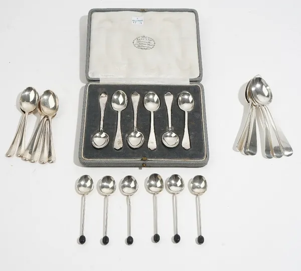 Silver flatware, comprising; a set of six Old English pattern teaspoons, London 1911, a set of six trefid end coffee spoons, Sheffield 1921, cased, a