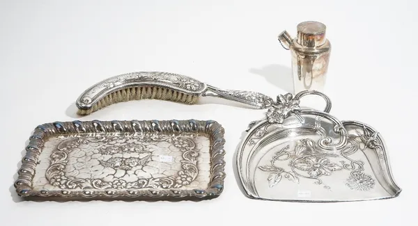 Plated wares, comprising; a crumb brush and tray, with Art Nouveau decoration, a shaped rectangular dressing table tray, embossed with cherub's faces