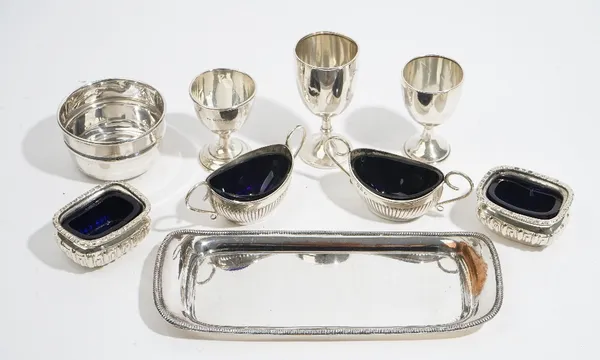 Silver, comprising; a small circular bowl, Sheffield 1946, three small trophy cups, a pair of twin handled boat shaped salts, Chester 1896, with blue