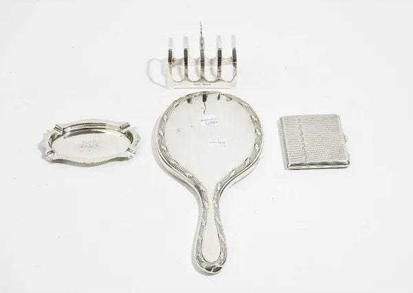 Silver and silver mounted wares, comprising; a five bar toastrack of angular form, London 1933, a hand mirror, London 1921, an oval ashtray, Birmingha