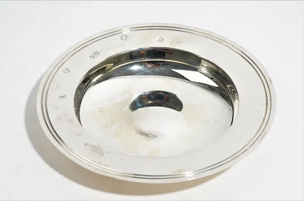 An Asprey & Garrard Britannia Standard Silver circular Armada style dish, London 2000, diameter 14.6cm, weight 168 gms, with an Asprey & Garrard box.