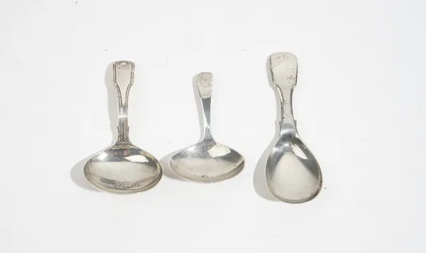 Silver caddy spoons comprising; a single struck fiddle, thread and shell pattern caddy spoon, Birmingham probably 1792, an Old English pattern caddy s