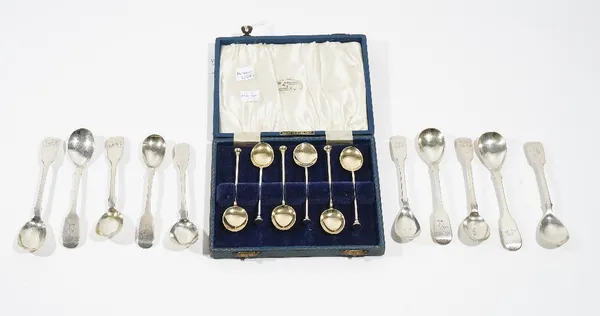 Three Irish silver fiddle pattern mustard spoons, crest engraved, Dublin 1855, seven further silver fiddle pattern mustard spoons, various dates and a