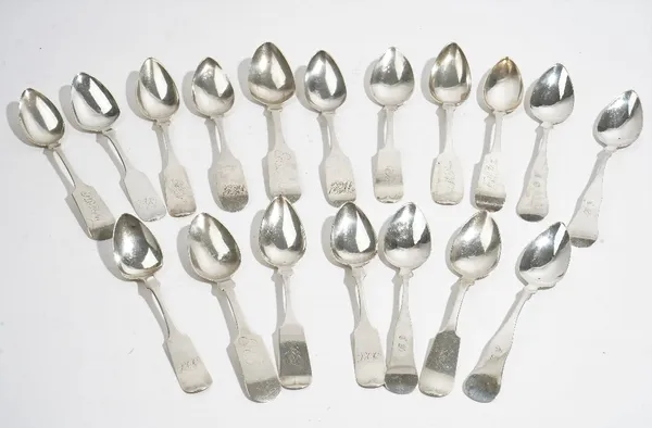 Eighteen mostly American fiddle pattern large teaspoons, differing makers, 19th century, mostly monogram engraved, combined weight 288 gms, (18).