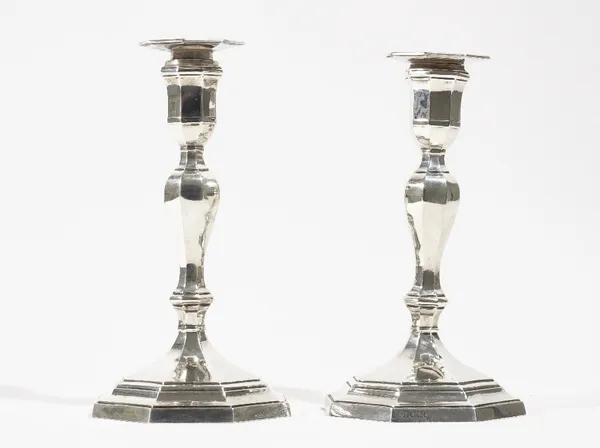 A pair of late Victorian silver table candlesticks, each raised on an octagonal stepped base (loaded), Sheffield 1900, height 21.5cm.