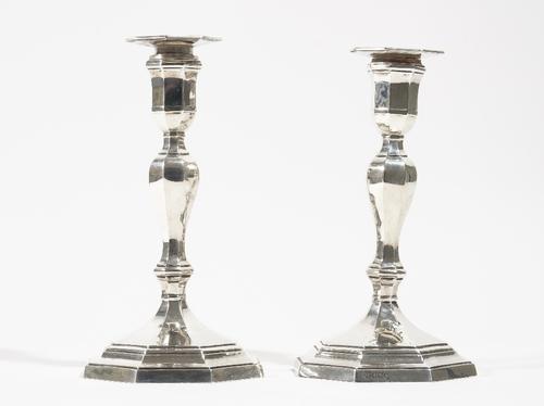 A pair of late Victorian silver table candlesticks, each raised on an octagonal stepped base (loaded), Sheffield 1900, height 21.5cm.