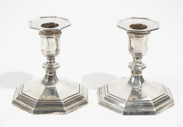 A pair of silver candlesticks, each raised on an octagonal stepped base (loaded), hallmarks rubbed, possibly Sheffield 1898, height 10.5cm.