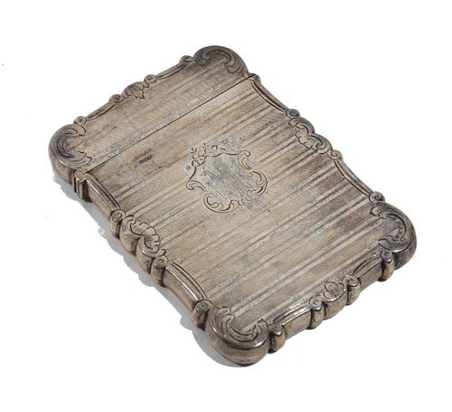 A Victorian silver shaped rectangular visiting card case, decorated with engine turned bands and with scrolls to the sides, maker Nathaniel Mills, Bir