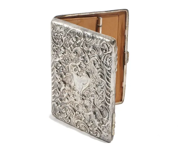 A silver shaped rectangular wallet, having a fitted leather interior enclosing a pencil, the exterior embossed with cherubs and floral scrolls, London