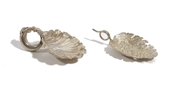 A silver caddy spoon, designed as a vine leaf and bunch of grapes, maker Joseph Willmore, Birmingham 1807 and another silver caddy spoon, of scallop f