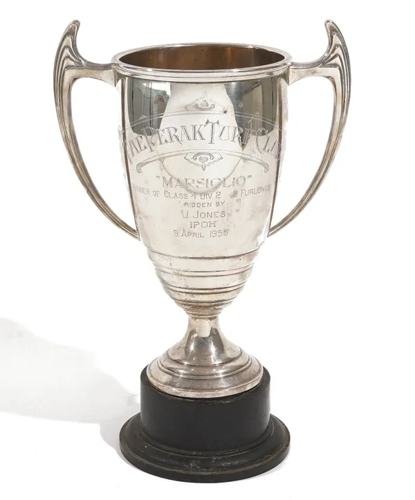 A silver twin handled trophy cup, engraved 'The Perak Turf Club', height 24cm, Birmingham 1953, weight 392 gms, with a black stand.