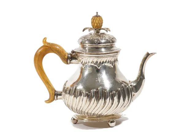 A Dutch silver teapot, of baluster form, with partly spiral fluted decoration, engraved with a crown and cypher of H.M Queen Mary, the hinged lid with