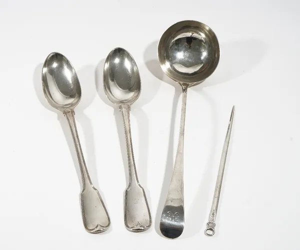 Four items of silver flatware, comprising;  a pair of George III double struck fiddle and thread pattern basting spoons, crest engraved, London 1817,