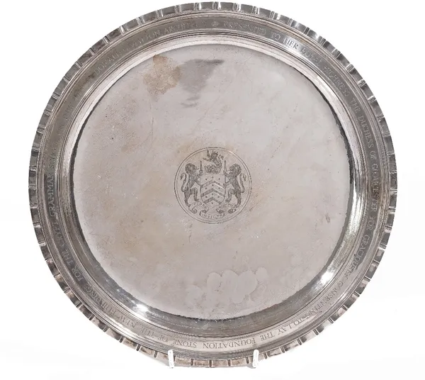 A silver circular salver, engraved to the centre with the arms of the City of Gloucester, the border presentation inscribed, Presented to Her Royal Hi