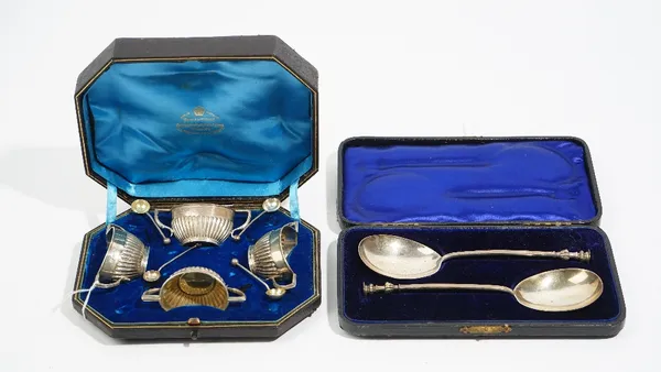 Silver, comprising; a pair of seal topped spoons, London 1900, cased and a set of four twin handled salts, with partly fluted decoration, Sheffield 18