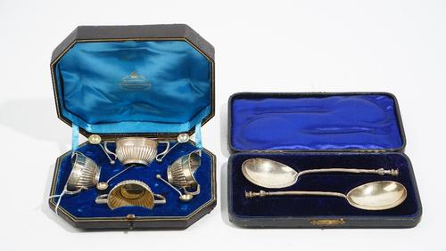 Silver, comprising; a pair of seal topped spoons, London 1900, cased and a set of four twin handled salts, with partly fluted decoration, Sheffield 18