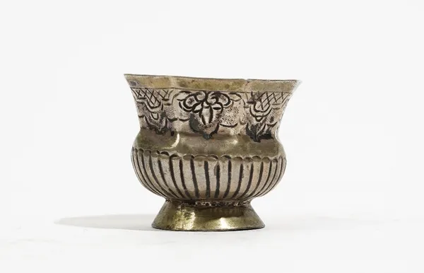 An 18th century Russian silver small beaker, probably Moscow circa 1760, marks mostly rubbed, of octagonal campana form, foliate engraved and partly f