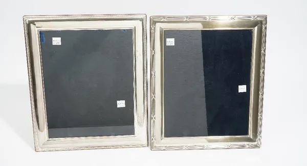 A silver mounted rectangular photograph frame, decorated with a beaded border, size of frame 32cm x 27cm and another silver mounted rectangular photog