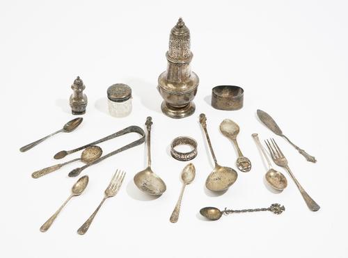 Silver and silver mounted wares, comprising: a Britannia standard sugar caster, probably London 1899, a pepperette, a small faceted glass jar, two nap