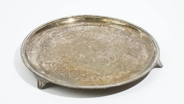 A silver salver of circular form, with engraved decoration within a reeded rim, raised on three feet, Birmingham 1909, 30cm diameter, 801 gms.