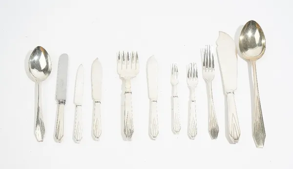 A table service of flatware, decorated in an Art Deco inspired design, comprising; eleven table forks, eleven dessert forks, twelve tablespoons, a pai