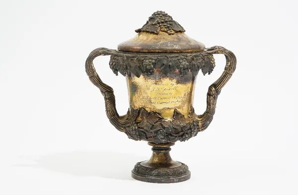 An Indian colonial silver-gilt trophy cup and cover, by Hamilton & Co, Calcutta, with applied grape and vine leaf cast decoration, presentation inscri