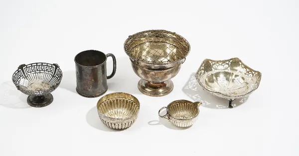 Silver comprising: a Victorian mug, Birmingham 1874, a rose bowl with a plated grille, a sweetmeats basket with a pierced body and ram's head finials,