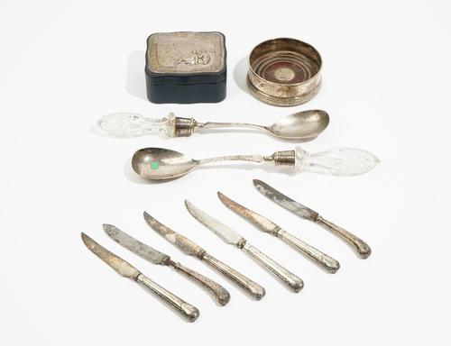 Silver mounted wares comprising: a rectangular cigarette box (hallmarks rubbed), a pair of salad servers with cut glass handles, Chester 1916, a circu