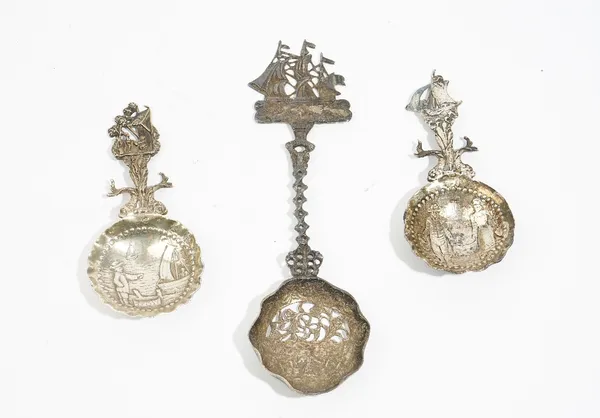 A Dutch silver spoon, the pierced bowl decorated with a figure holding buckets, cast handle with sailing ship finial, import marks for London 1904, an