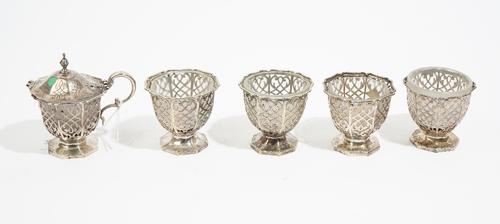 A Victorian silver mustard pot, by Samuel Hayne and Dudley Cater, London 1853, with pierced scroll work decoration, the hinged cover engraved and havi