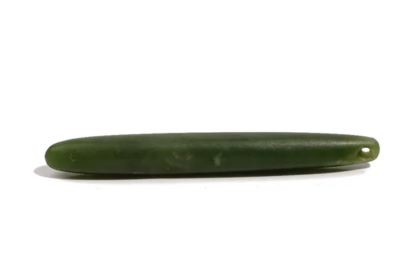 A Maori pounamu or greenstone pendant, of rounded elongated form, 12cm long.