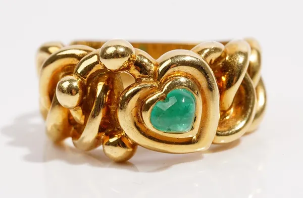 An 18ct gold and emerald ring dress ring byGarrardOf abstract heart design, set with a cabochon emerald, weight 12.6gms, ring size S and a half.