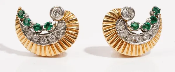 A pair of crescent shaped gold, emerald anddiamond-set earclipsThe collet-set diamonds above a row of graduatedcircular-cut diamonds and emeralds, set