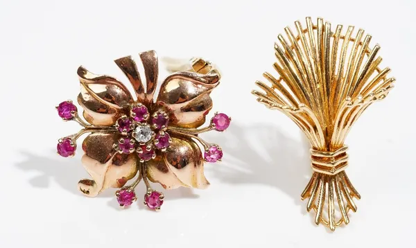 A ruby and diamond-set single earclip  Of flowerhead design; and another single earclip of  wheat sheath design, both set in yellow precious metal  (p