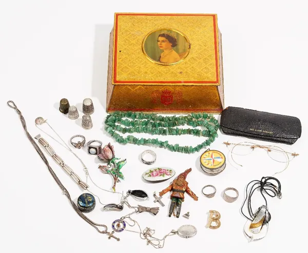 A group of eighteen items of jewellery, including; five mostly silver rings and two brooches of floral design, four thimbles, a McVitie & Price Ltd ti