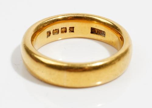 A 22ct gold wedding ring, ring size J and a half, London probably 1922, weight 9.8 gms, with a box.
