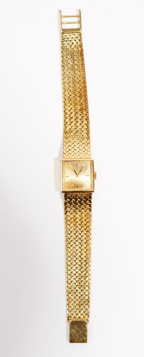 An Omega lady's gold square cased wrist watch, with a signed, jewelled automatic circular movement, detailed Omega Watch Co., detailed within the case