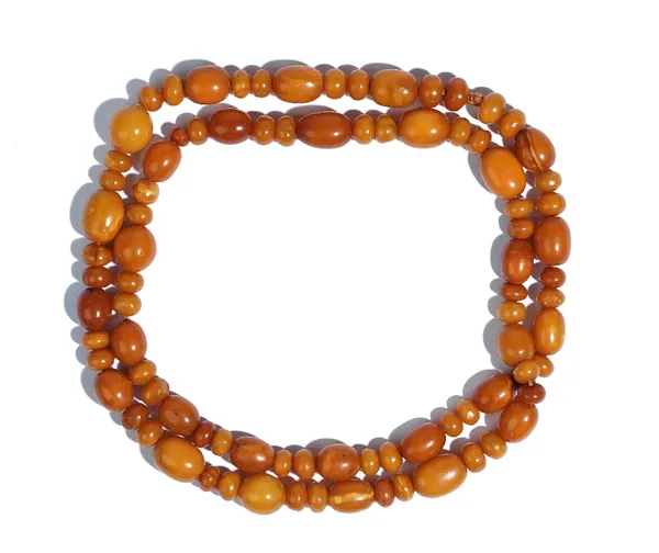 A single row necklace of varicoloured, butterscotch coloured amber beads, of varying size, gross weight 55.5 gms.