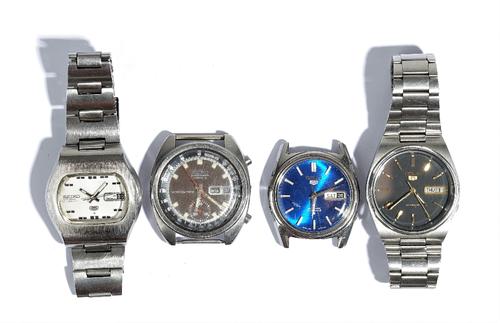 A Seiko Chronograph Automatic steel cased gentleman's wristwatch, with a day of the week and date of the month aperture, outer tachymeter scale, the s